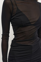 Black long-sleeve dress with sheer mesh panels on a plain background