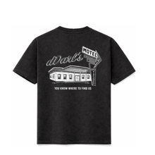 Black t-shirt with white graphic design on a white background