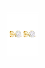 Gold bow-shaped earrings with clear gemstones on a white background
